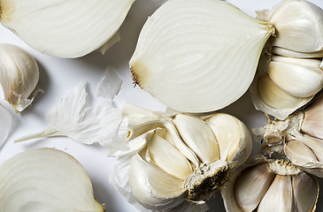 Image showing Broken heads of garlic and white onions