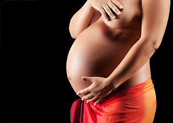 Image showing Beautyful Naked Pregnant woman caressing her belly