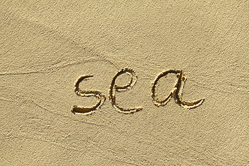 Image showing Natural sand background with scrawled word ''Sea''