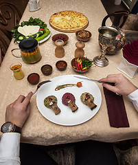 Image showing Man eating in georgian restaurant