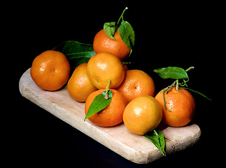 Image showing Ripe Tangerines with Leafs