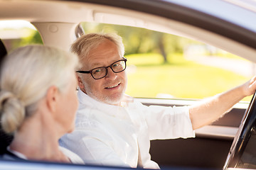 Image showing happy senior couple driving in car