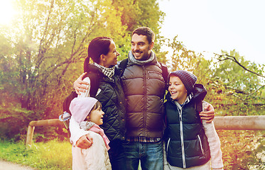 Image showing happy family with backpacks hiking