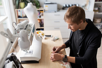 Image showing fashion designer with making dress at studio