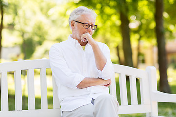 Image showing thoughtful senior man at summer park