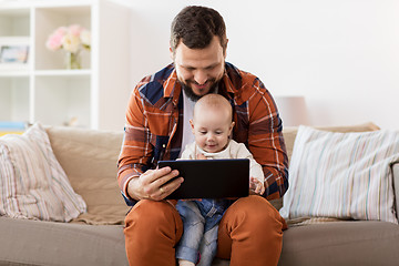 Image showing happy father and baby boy with tablet pc at home