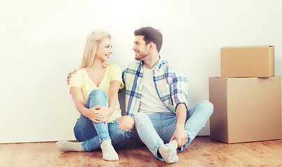 Image showing couple with cardboard boxes moving to new home