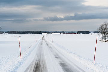 Image showing Country road with snow stakes