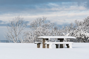 Image showing Snow covered resting place