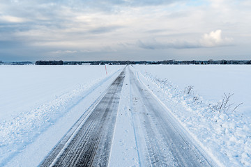 Image showing Straight road in a wintry landscape