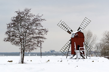 Image showing Old windmill in a winter scenery