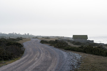 Image showing Winding gravel road by the coast