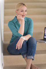 Image showing portrait of a young beautiful woman on the stairs