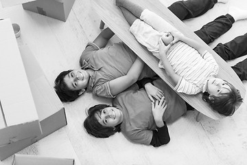 Image showing boys with cardboard boxes around them top view