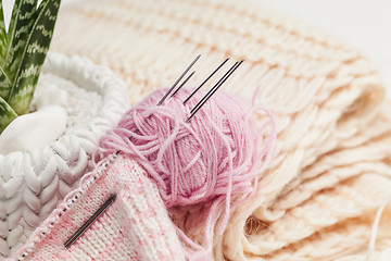 Image showing The balls of wool on white wooden background