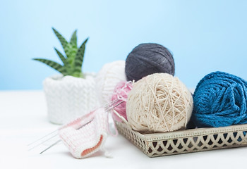 Image showing The balls of wool on white wooden background