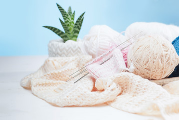 Image showing The balls of wool on white wooden background