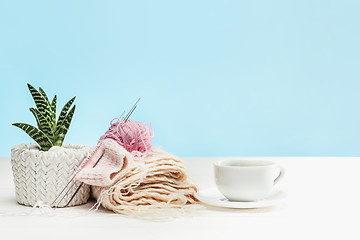 Image showing The balls of wool on white wooden background