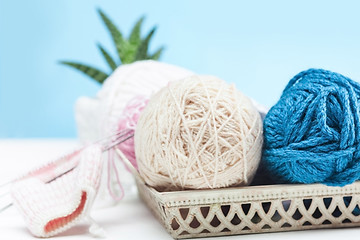 Image showing The balls of wool on white wooden background