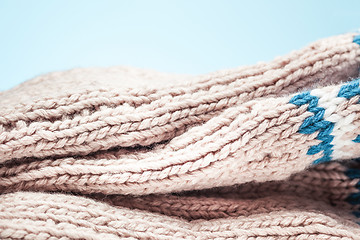 Image showing large folds on the warm knit light scarf