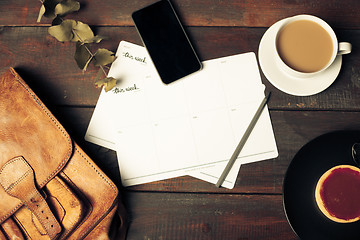 Image showing Opened craft paper envelope , autumn leaves and coffee on wooden table