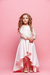 Image showing Full length of beautiful little girl in dress standing and posing over white background