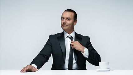 Image showing The attractive man in black suit on white background