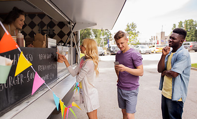 Image showing happy customers queue at food truck