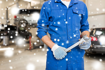 Image showing auto mechanic or smith with wrench at car workshop