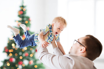 Image showing happy father playing with son at christmas