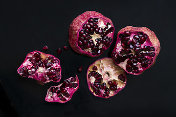 Image showing Two pomegranates on a black background