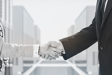 Image showing business man and woman handshake on  meeting