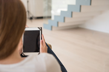 Image showing woman sitting on sofa with tablet computer