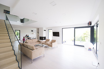 Image showing family with little girl enjoys in the modern living room