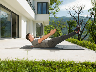 Image showing man doing morning yoga exercises