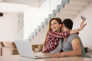 Image showing happy young couple buying online