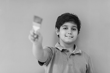 Image showing Portrait of a happy young boy painter