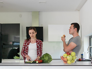 Image showing Young handsome couple in the kitchen