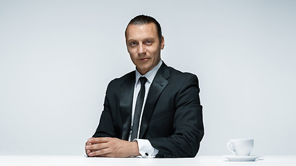 Image showing The attractive man in black suit on white background