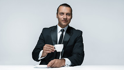 Image showing The attractive man in black suit on white background