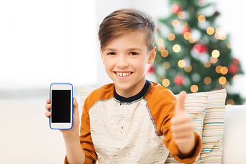 Image showing boy with smartphone at christmas showing thumbs up