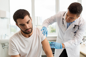 Image showing patient and doctor with syringe doing injection