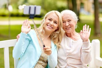 Image showing daughter and senior mother taking selfie at park