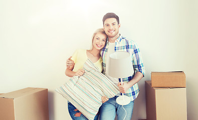 Image showing happy couple with stuff moving to new home