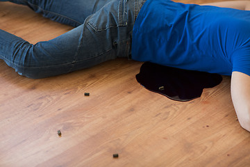 Image showing dead man body in blood on floor at crime scene