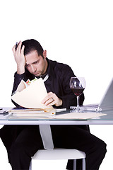 Image showing Stressed Businessman at His Desk Working