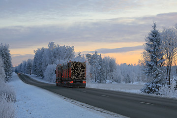 Image showing Dusktime Winter Road with Logging Truck