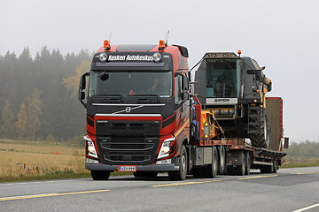 Image showing Volvo FH Semi Trailer Hauls Combine