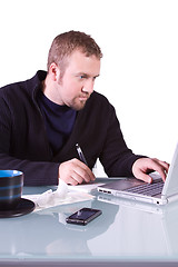 Image showing Young Casual Businessman Working at his Desk