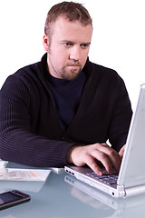 Image showing Young Casual Businessman Working at his Desk